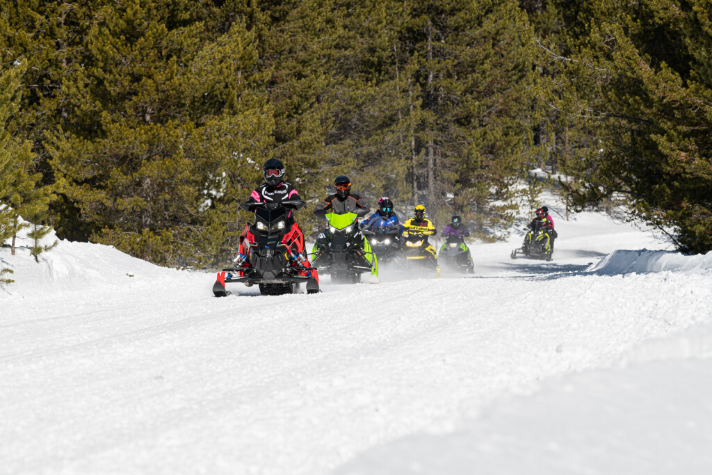 Snowmobiles on trail